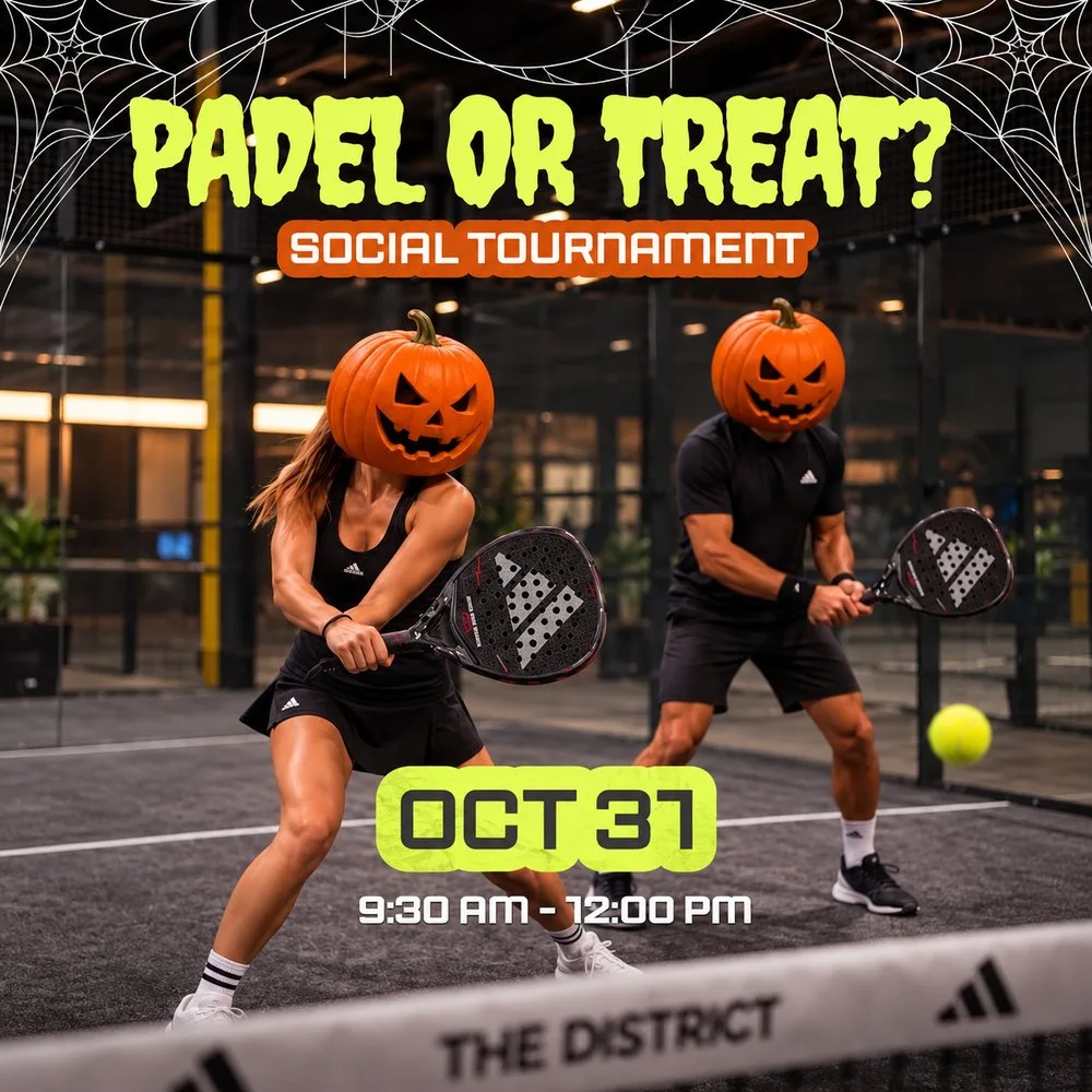 Two players wearing jack-o’-lantern pumpkin heads play padel on court at The District’s Halloween tournament