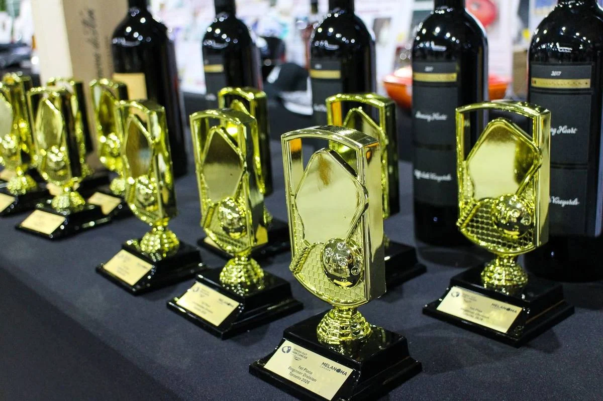 Smash Out Skin Cancer tournament trophies lined up at The District
