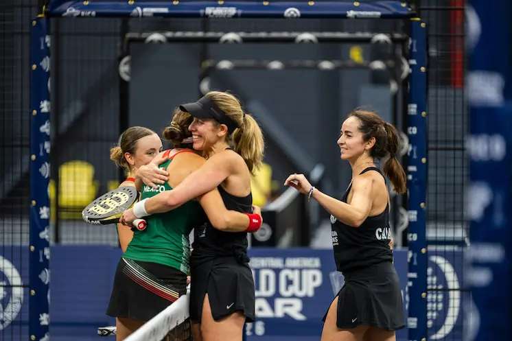 Mexico and Canada women embrace at the net after their tie at the FIP World Cup Qualifier